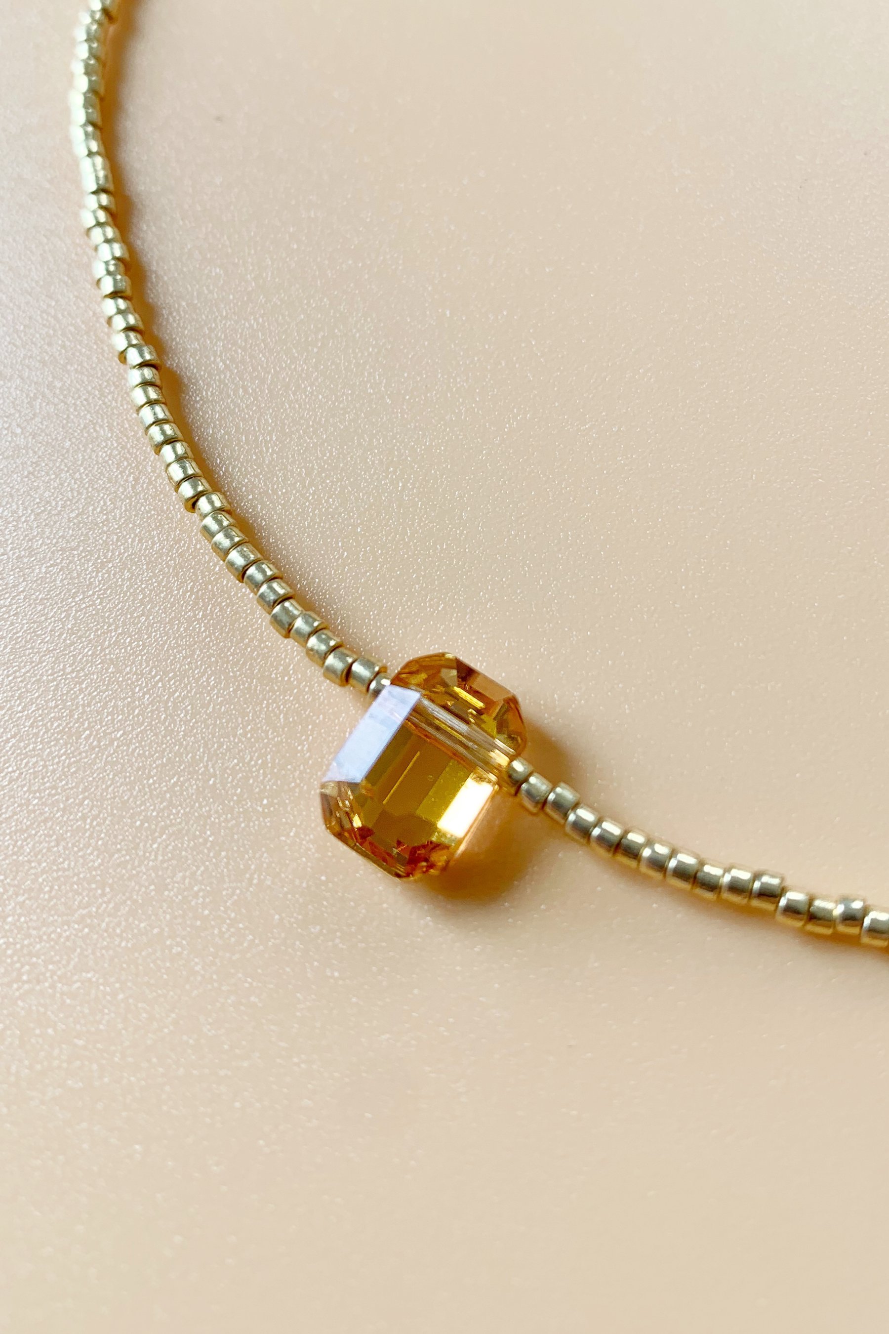Collier perles dorées & cristal orange